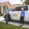 business owners in front of company truck